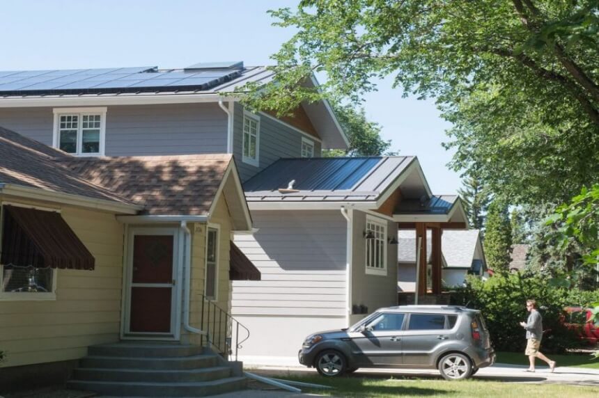 Matthew Pointer walks up the driveway to his home on Cameron Street. Pointer is a committee member with the Wascana Solar Co-operative and his house has solar panels affixed to its roof. BRANDON HARDER / Regina Leader-Post